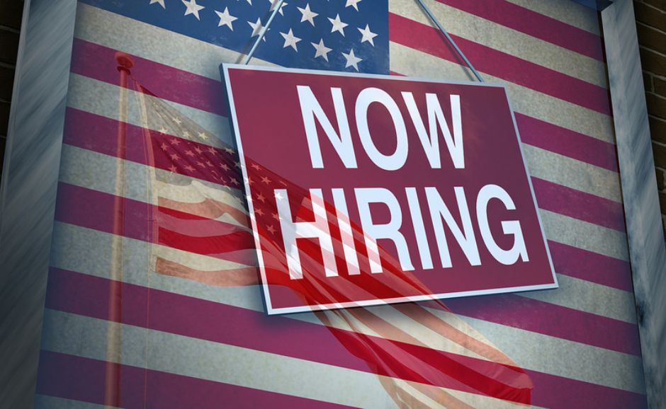 image of hiring sign with US flag background