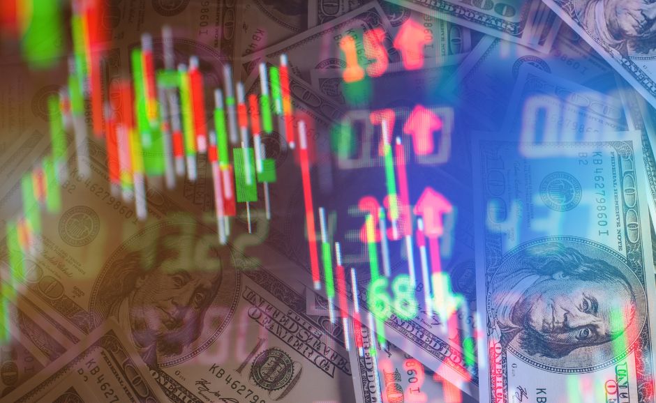 USD banknotes with trading chart overlay